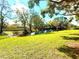 Serene backyard view with a tranquil canal and lush green lawn offering a peaceful outdoor retreat at 9006 Callaway Dr, Trinity, FL 34655