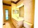 Upstairs bathroom features tiled floors, vanity with storage, and back door at 9006 Callaway Dr, Trinity, FL 34655