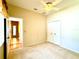 Neutral bedroom with carpet, ceiling fan and closet plus view to entry hall at 9006 Callaway Dr, Trinity, FL 34655