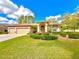 Charming single-story home featuring a well-manicured lawn and a spacious three-car garage at 9006 Callaway Dr, Trinity, FL 34655