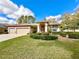 Charming single-story home featuring a well-manicured lawn and a spacious three-car garage at 9006 Callaway Dr, Trinity, FL 34655