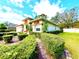 Charming single-Gathering home featuring manicured landscaping, decorative columns, and a two-car garage at 9006 Callaway Dr, Trinity, FL 34655