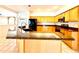 Beautiful kitchen with granite counters, stainless steel appliances, and convenient island space at 9006 Callaway Dr, Trinity, FL 34655