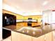 Bright, airy kitchen featuring granite countertops, light wood cabinetry and modern stainless steel appliances at 9006 Callaway Dr, Trinity, FL 34655