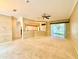 Spacious living room with neutral carpet, ample natural light, and open floor plan at 9006 Callaway Dr, Trinity, FL 34655