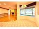 Bright open floor plan with a fireplace in the living room and a bay window in the dining area at 9006 Callaway Dr, Trinity, FL 34655