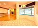 View from kitchen area to living room featuring fireplace, hardwood floors, and sliding glass doors at 9006 Callaway Dr, Trinity, FL 34655