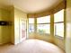 Bright sun room with neutral colored carpet and lots of windows offering view to the outdoors at 9006 Callaway Dr, Trinity, FL 34655