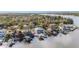 Stunning aerial of waterfront homes along a picturesque river, each with private docks and beautiful landscaping at 9920 Alavista Dr, Gibsonton, FL 33534