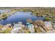 Beautiful neighborhood on the water featuring private docks, lush landscaping, and a tranquil lake at 9920 Alavista Dr, Gibsonton, FL 33534