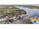 Scenic aerial view of waterfront homes along the river with a mix of lush trees, homes, and clear water at 9920 Alavista Dr, Gibsonton, FL 33534