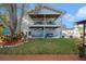 Charming two-story home featuring a covered patio, hot tub, and lush backyard perfect for outdoor entertaining at 9920 Alavista Dr, Gibsonton, FL 33534