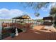 Waterfront dock featuring a boat lift, bar, and seating area; an ideal spot for enjoying the lake at 9920 Alavista Dr, Gibsonton, FL 33534