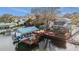 Waterfront home featuring a private dock with boat lift and entertainment area at 9920 Alavista Dr, Gibsonton, FL 33534