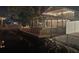 Waterfront home features a backyard deck, gazebo, outdoor lights, and white privacy fence at 9920 Alavista Dr, Gibsonton, FL 33534
