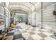 Image of a spacious garage with a checkered floor and ample space for various projects and storage at 9920 Alavista Dr, Gibsonton, FL 33534