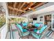 Expansive outdoor deck with ample seating and ceiling fans, perfect for enjoying the waterfront at 9920 Alavista Dr, Gibsonton, FL 33534
