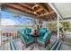 Inviting outdoor deck with dining and seating areas, offering picturesque lake views at 9920 Alavista Dr, Gibsonton, FL 33534