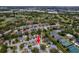 Aerial view shows property's location within a vibrant community, near tennis courts, golf course and waterfront at 10064 82Nd St, Seminole, FL 33777