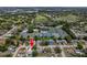 Aerial view of neighborhood featuring golf course, pools and tennis courts at 10064 82Nd St, Seminole, FL 33777