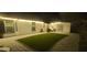 A well-maintained backyard features a patio, a cozy sitting area, and a patch of artificial turf at 10064 82Nd St, Seminole, FL 33777