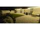 A charming backyard with brick pavers, artificial turf, and inviting seating area with outdoor lighting at 10064 82Nd St, Seminole, FL 33777