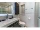 Modern bathroom features a sleek vanity, tiled shower, and a frameless glass enclosure at 10064 82Nd St, Seminole, FL 33777
