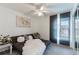 The modern bedroom features a daybed and sheer sliding door at 10064 82Nd St, Seminole, FL 33777
