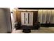 Elegant front door with modern lighting and lovely planter arrangements for added curb appeal at 10064 82Nd St, Seminole, FL 33777