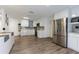 Modern kitchen featuring white cabinetry, stainless steel appliances, and tile backsplash at 10064 82Nd St, Seminole, FL 33777