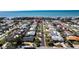 Aerial view of the neighborhood with blue ocean in the distance at 102 23Rd St, Belleair Beach, FL 33786