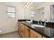 Bright bathroom with double granite vanity, ample storage, and decorative faucets at 102 23Rd St, Belleair Beach, FL 33786