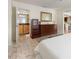 Bedroom with light wood floors, furnishings, and access to a bathroom and kitchen at 102 23Rd St, Belleair Beach, FL 33786