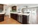 Stylish kitchen featuring a breakfast bar, stainless steel appliances, and tile flooring at 102 23Rd St, Belleair Beach, FL 33786