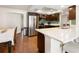 Well-lit kitchen featuring stainless steel appliances, a breakfast bar and tile floors at 102 23Rd St, Belleair Beach, FL 33786