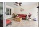 Inviting outdoor patio with comfortable seating, ceiling fan, and charming decor at 102 23Rd St, Belleair Beach, FL 33786
