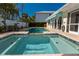Captivating pool area featuring a spa, pool and outdoor patio for easy entertaining at 102 23Rd St, Belleair Beach, FL 33786