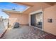 Spacious back porch featuring brick pavers, air conditioning unit and sliding glass doors at 10467 Larchmont N Pl, Pinellas Park, FL 33782