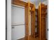 Spacious closet with custom wooden shelving and ample storage space for an organized wardrobe at 10467 Larchmont N Pl, Pinellas Park, FL 33782