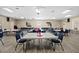 A spacious room featuring tables and chairs, designed for various activities and community gatherings at 10467 Larchmont N Pl, Pinellas Park, FL 33782