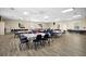 Spacious community room featuring tables and chairs, ideal for events and gatherings at 10467 Larchmont N Pl, Pinellas Park, FL 33782