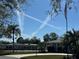Beautiful community view with lush landscaping and walkways under a bright blue sky at 10467 Larchmont N Pl, Pinellas Park, FL 33782