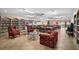 Library featuring bookshelves and comfortable seating for reading and community at 10467 Larchmont N Pl, Pinellas Park, FL 33782