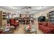 A library featuring bookshelves, tables, and comfortable seating at 10467 Larchmont N Pl, Pinellas Park, FL 33782