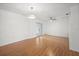 Bright living room with hardwood floors, modern lighting, and french doors at 10467 Larchmont N Pl, Pinellas Park, FL 33782