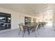 A covered outdoor patio with patio seating at 10467 Larchmont N Pl, Pinellas Park, FL 33782
