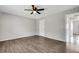 Empty bedroom features luxury vinyl flooring, ceiling fan, and neutral paint at 105 Lotus Cir, Safety Harbor, FL 34695