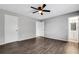 Bedroom featuring luxury vinyl flooring, two closets, and an ensuite bathroom at 105 Lotus Cir, Safety Harbor, FL 34695