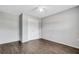 Spacious bedroom with hardwood floors and a closet with white bifold doors at 105 Lotus Cir, Safety Harbor, FL 34695