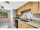 Kitchen area with granite countertops, stainless steel appliances, and ample cabinet space at 105 Lotus Cir, Safety Harbor, FL 34695